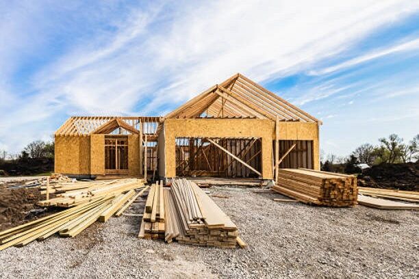 a house under construction with wood beams