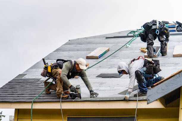 a group of men working on a roof